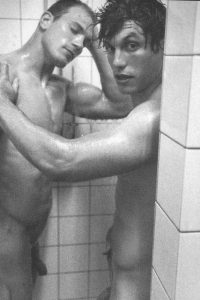 Naked sportsmen showering